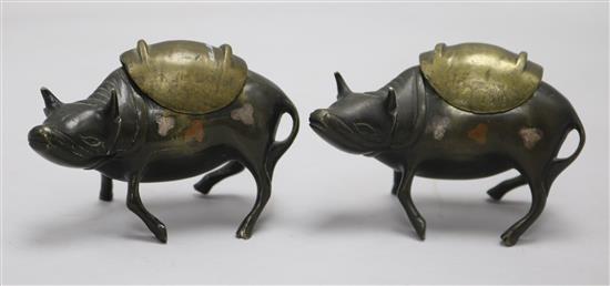 A pair of Chinese bronze, silver and copper decorated ox censers and covers